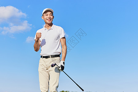 打高尔夫男性做加油动作图片