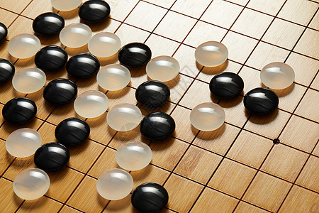 黑白文化围棋盘上的黑白棋子背景