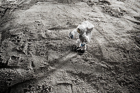 太空登月创意小人俯拍背景图片