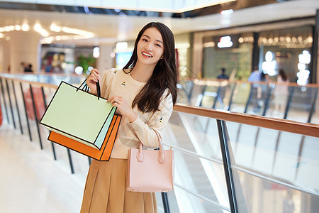 青年女性购物手提购物袋形象图片