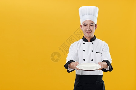 端着空盘子的厨师形象图片