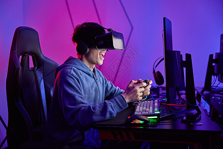 青年男性打游戏电竞选手戴VR眼镜打游戏背景