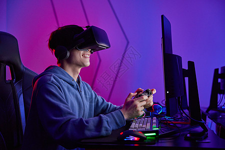 VR体验店电竞选手戴VR眼镜打游戏背景