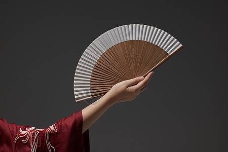 现代中国风女生的手拿着折扇背景