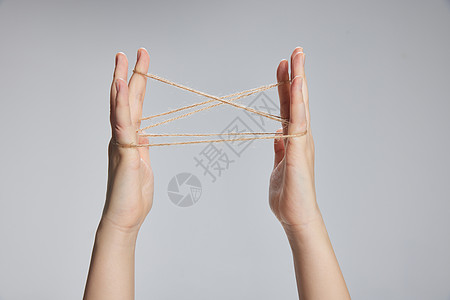 翻馓双手翻绳游戏特写背景