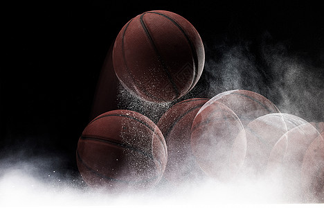 篮球掉落在地上扬起粉尘频闪运动轨迹图片