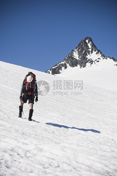 美国华盛顿北卡斯德公园Shuksan山上攀登硫化冰川的人图片