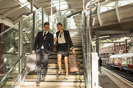 商人和女下楼地车站联合王国伦敦图片