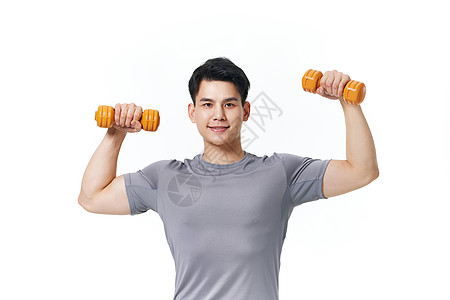 健康男性使用哑铃健身背景图片