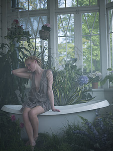 坐在室里满是植物的浴缸边缘的年轻女人图片