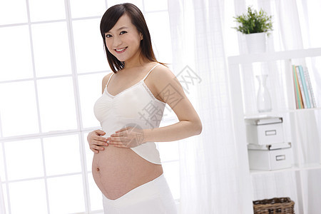 微笑母亲人幸福的孕妇背景图片