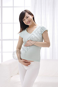 简单亚洲母亲幸福的孕妇图片