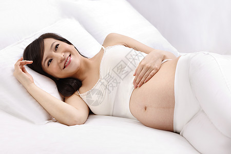 躺着女人人孕妇躺在床上图片
