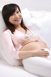 户内健康生活方式青年女人孕妇躺在床上睡觉图片
