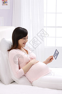 打印单据渴望技术孕妇拿着超声波照片图片
