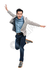 成功愉悦自信快乐跳跃的青年商务男士图片