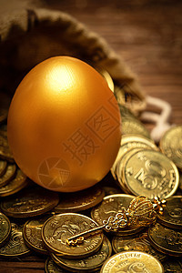 商务袋子里的金蛋金币金钥匙图片