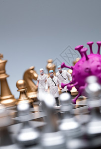 国际象棋棋盘上的医护人员和病毒图片