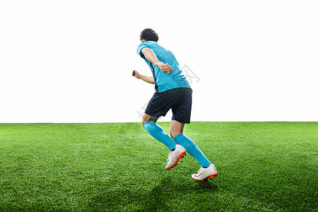 体育活动体育健身一名男足球运动员踢球图片