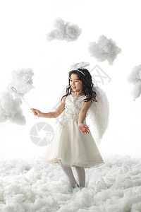 幸福玩具亚洲拿着魔法棒的快乐小天使图片
