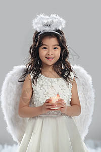 虚构童年活力拿着蜡烛的快乐小天使图片