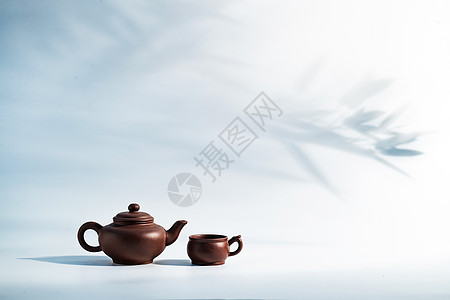 茶元素竹子背景下的茶壶背景