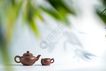 竹子装饰瓷器陶瓷制品竹叶下的茶壶背景