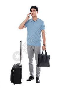 网络社交摄影领导能力拿行李箱的商务男士打电话图片