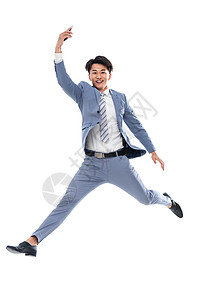 成功注视镜头快乐拿着手机奔跑跳跃的商务男士图片