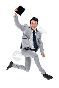 青年男人乐趣彩色图片拿着平板电脑跳跃的商务男士图片