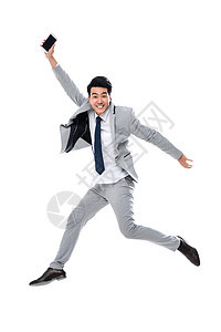 商务人士好消息互联网拿着手机跳跃的商务男士背景图片