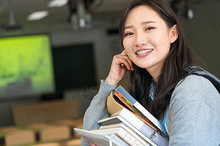 亚洲人教育堆叠大学生在教室里学习图片