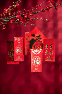 恭喜发财庆祝亚洲悬挂在梅花下面的红包图片
