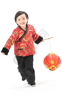 背景分离垂直构图愉悦一个小男孩手提红色灯笼庆祝新年图片