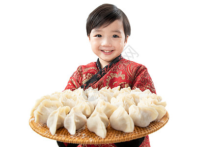 兴奋欢乐无忧无虑小男孩过年包饺子图片
