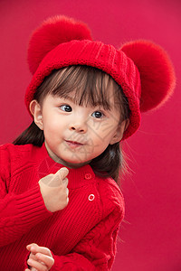 传统节日庆祝可爱的穿红衣戴红帽的可爱小女孩图片