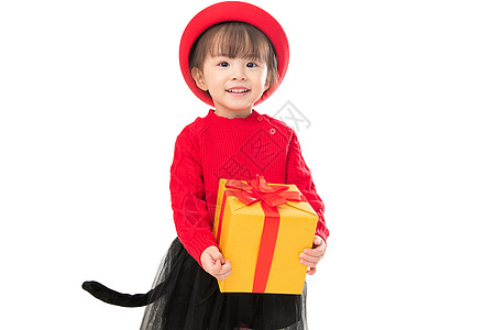有趣的祝福无忧无虑可爱的小女孩拿着新年礼物图片