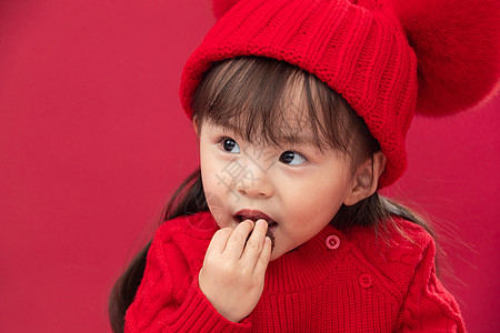 摄影彩色图片拜年穿红衣戴红帽的可爱小女孩图片