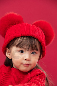 传统节日亚洲节日穿红衣戴红帽的可爱小女孩图片