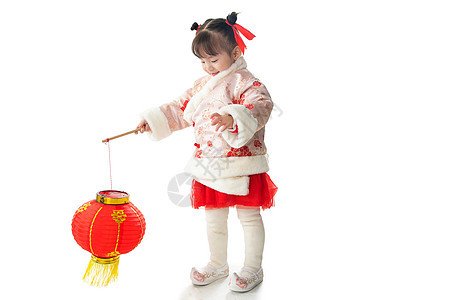 传统文化影棚拍摄愉悦可爱的小女孩拿着红灯笼图片