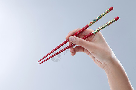 亚洲彩色图片留白手拿筷子图片