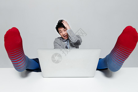 公司企业工作亚洲人表情震惊的商务男士图片