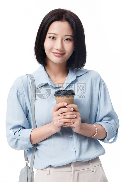 职业商务人士放松女白领手拿咖啡杯图片