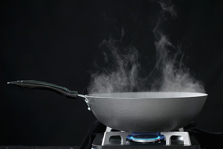 热烟烹调用具燃气灶和炒锅图片