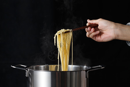 不锈钢筷子煮饮食烹调意大利面背景