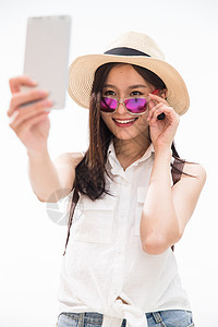 摄影遮阳帽仅女人青年女孩用手机拍照图片