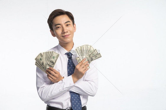 乐趣亚洲人商务青年男人拿着美元图片
