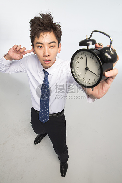 人仅一个人亚洲人商务青年男人拿着闹钟图片