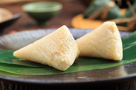 叶子特写端午美食白米粽子背景