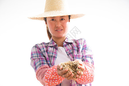 戴草帽捧着麦子的农民图片
